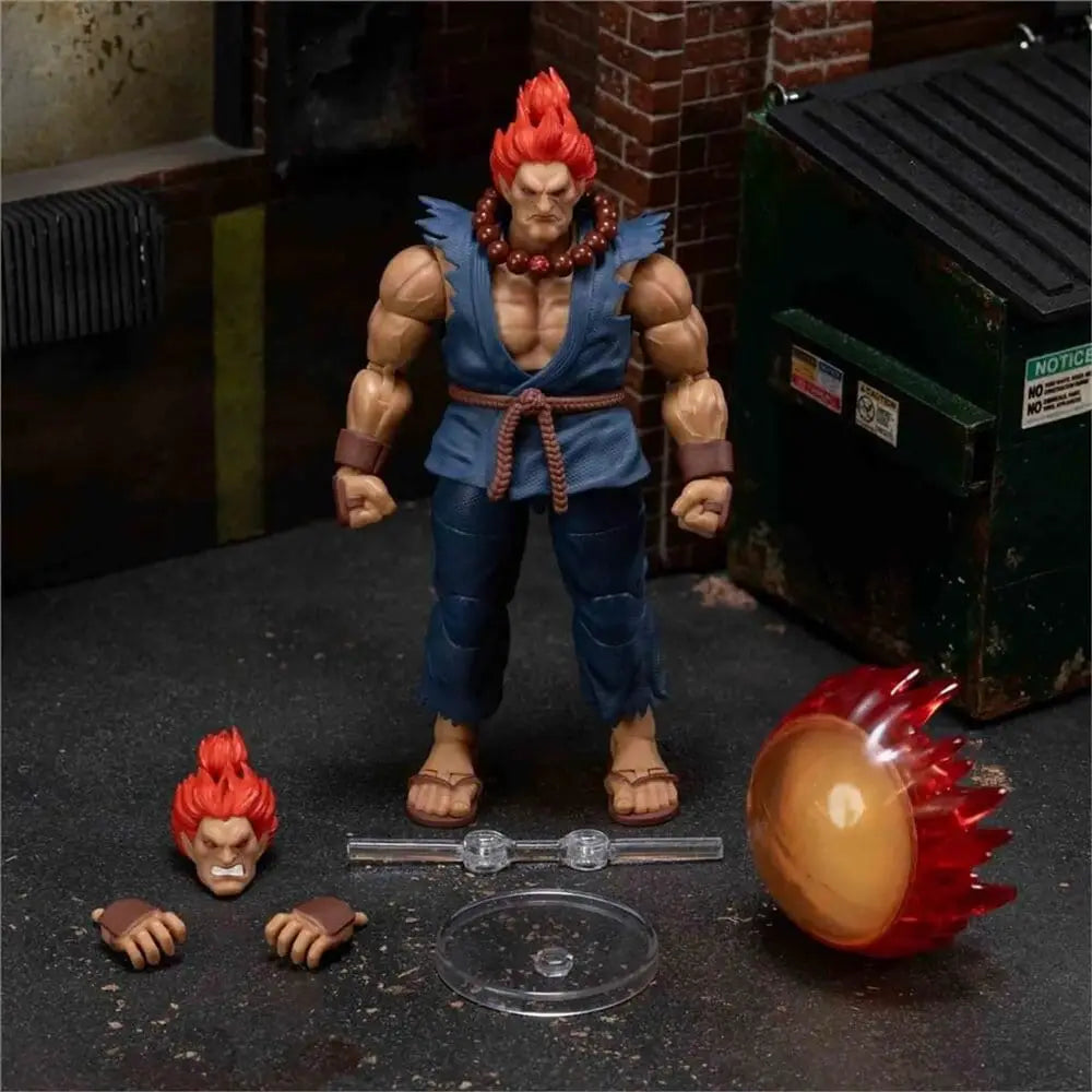 Street Fighter Akuma 1/12 action figure by Jada Toys; blue gi, orange hair; includes extra head and two fists.