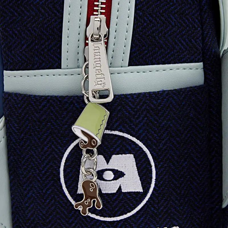Mochila mini Loungefly Monstruos S.A. en tela azul marino con ribete azul claro y llavero decorativo verde limón.
