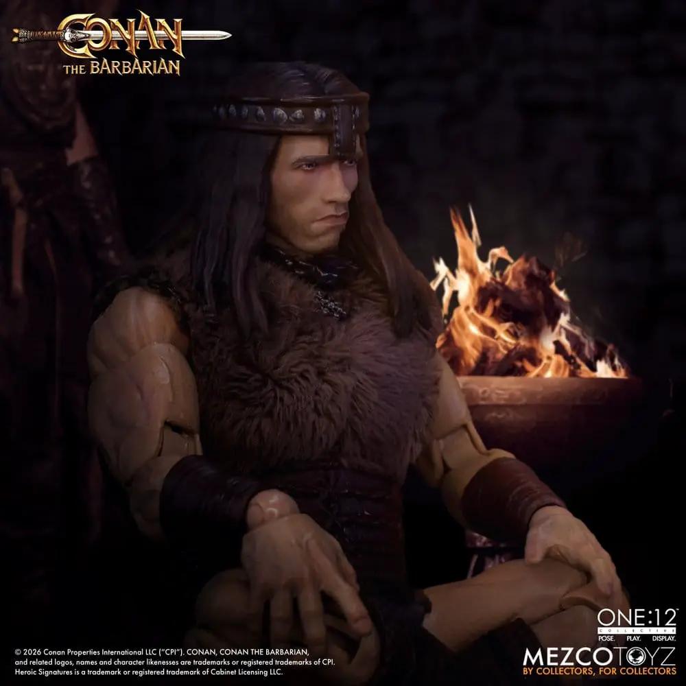Conan the Barbarian One:12 Collective action figure by Mezco Toys, Pit Fighter Edition, seated by a fire