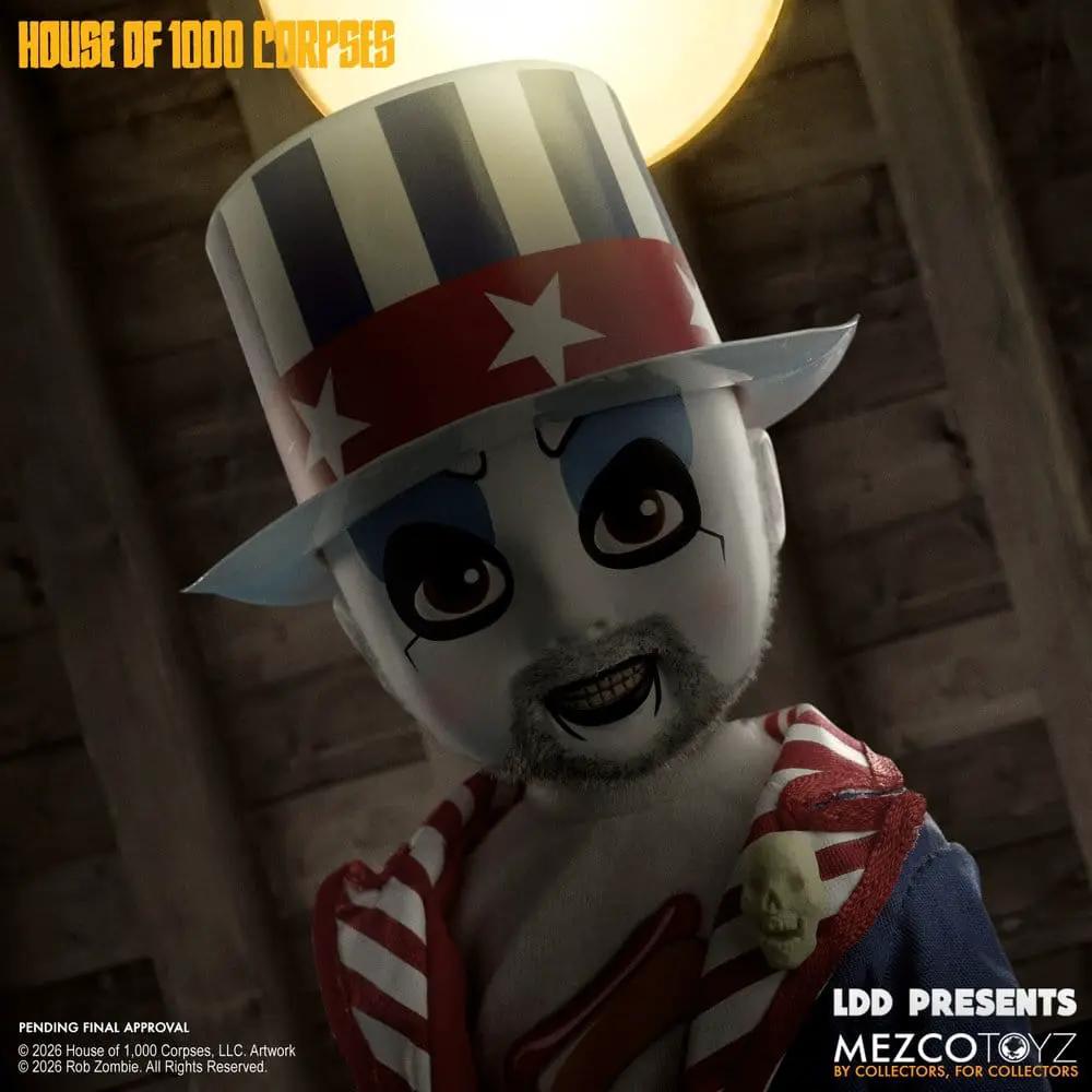 Figura Captain Spaulding MEZCO TOYS, 25 cm; payaso blanco con sombrero a rayas azul/blanco y banda roja con estrellas.
