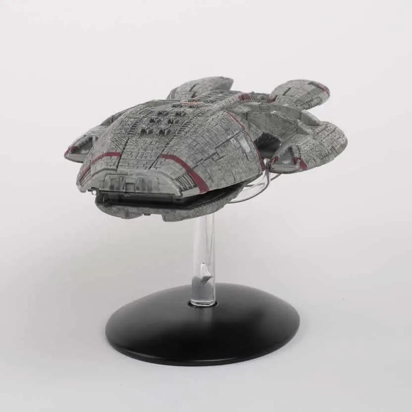 Battlestar Galactica Blood and Chrome 27 cm model spaceship by MASTER REPLICAS, gray with red accents on display stand