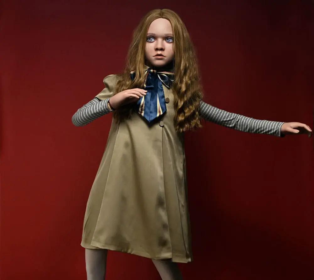 NECA Megan 1/1 Megan Doll, 140 cm; life-size figure in beige coat, striped sleeves, blue necktie.