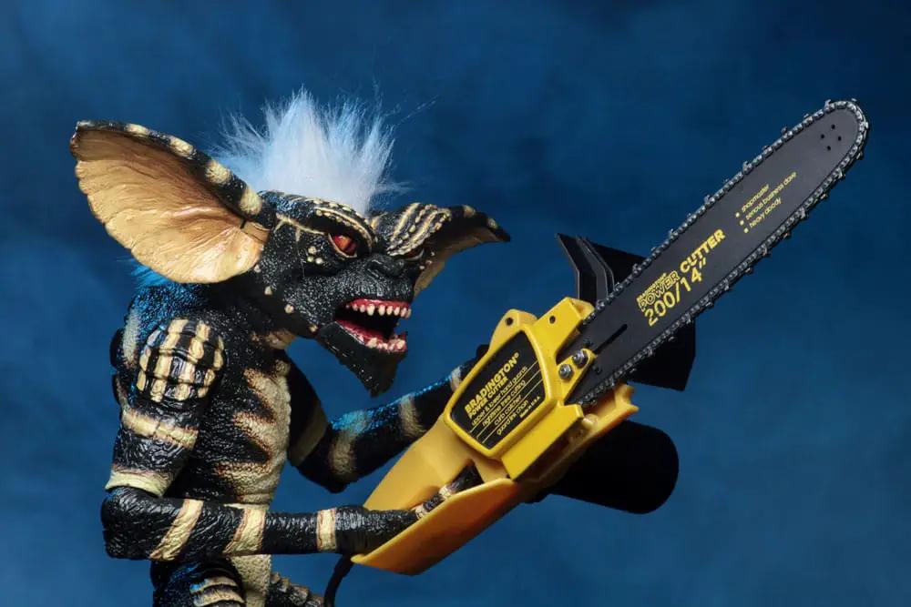 Gremlins Evolution of a Gremlin 40th anniversario figure with yellow chainsaw accessory by NECA
