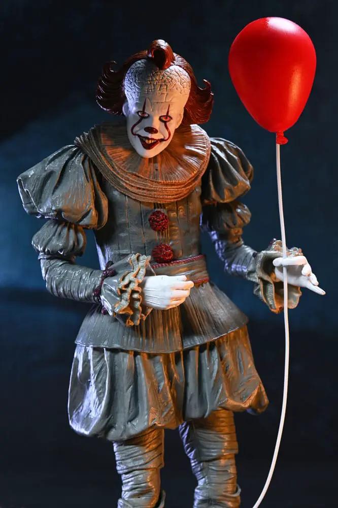 Pennywise Ultimate 17cm action figure by NECA in gray clown suit holding a red balloon