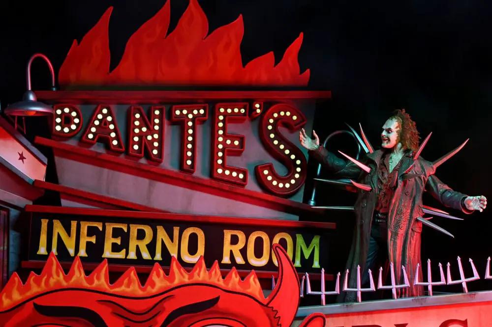 Beetlejuice diorama figure by NECA in a spiked trench coat on the Inferno Room Deluxe Set with Dante's sign and flames