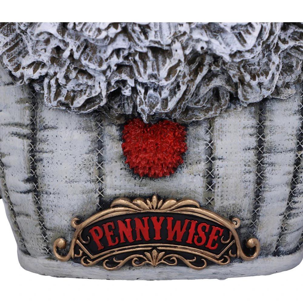 Pennywise bust figurine by Nemesis Now, 30 cm, gray textured base with red heart and ornate bronze plaque.