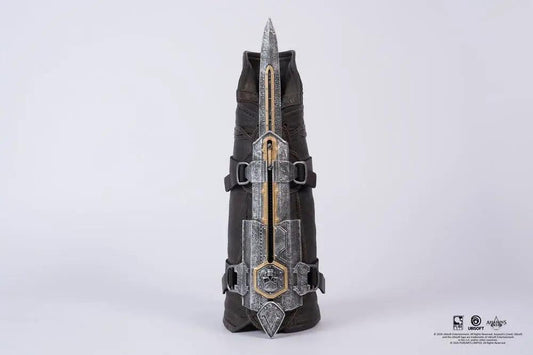 Hidden Blade replica from Assassin’s Creed Black Flag by PURE ARTS; silver with gold accents and leather straps.