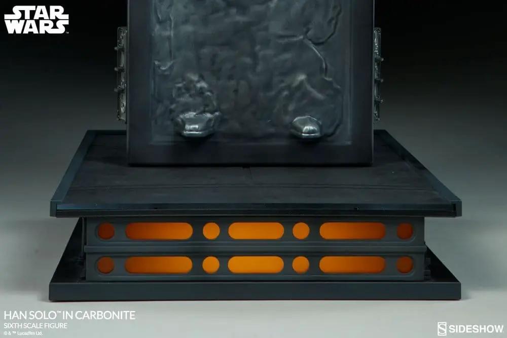 Han Solo in Carbonite 1:6 action figure by Sideshow Collectibles on a display base with orange-lit panels.