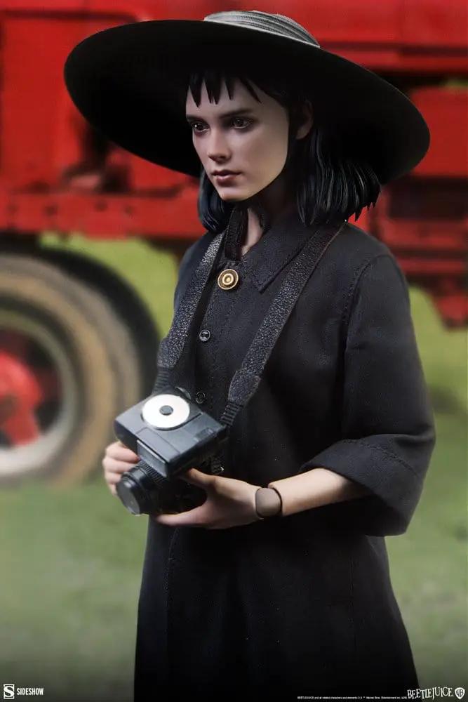 Lydia Deetz 1/6 Beetlejuice figure by Sideshow Collectibles, in a black dress with wide-brim hat holding a camera.