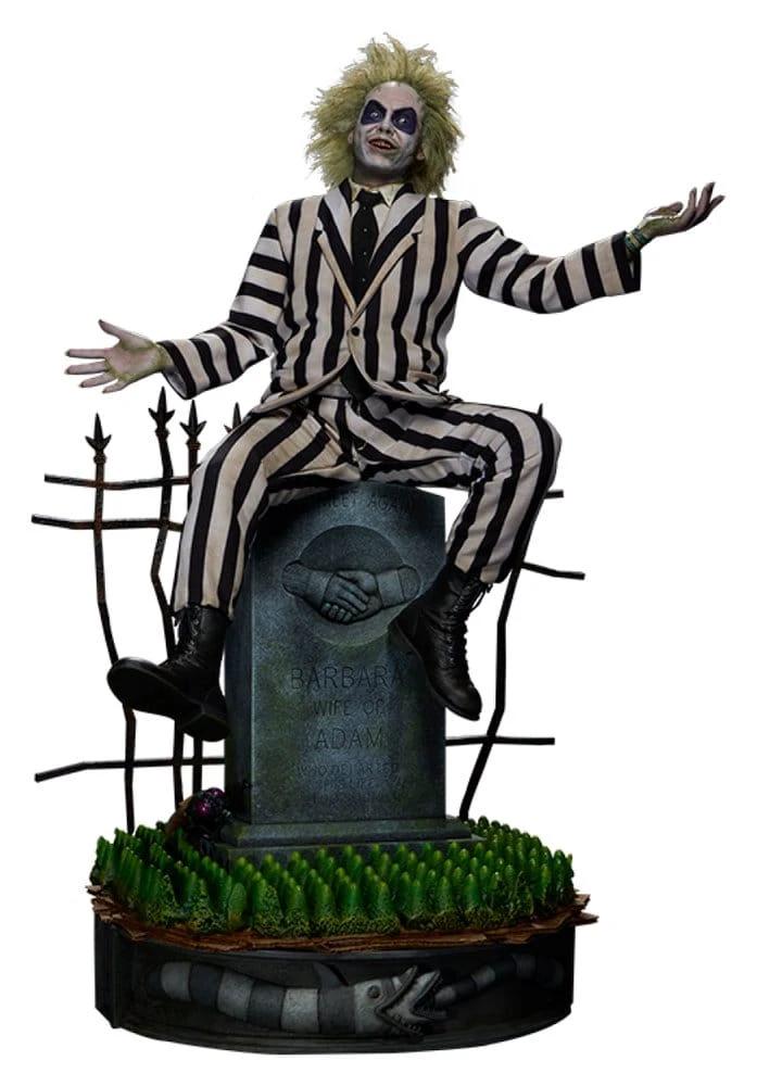 Beetlejuice Premium Format Mixed Media Statue by Sideshow Collectibles, striped black-and-white suit on tomb pedestal.
