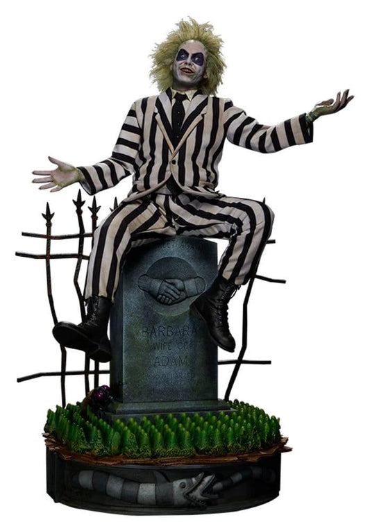 Beetlejuice Premium Format Mixed Media Statue by Sideshow Collectibles, striped black-and-white suit on tomb pedestal.