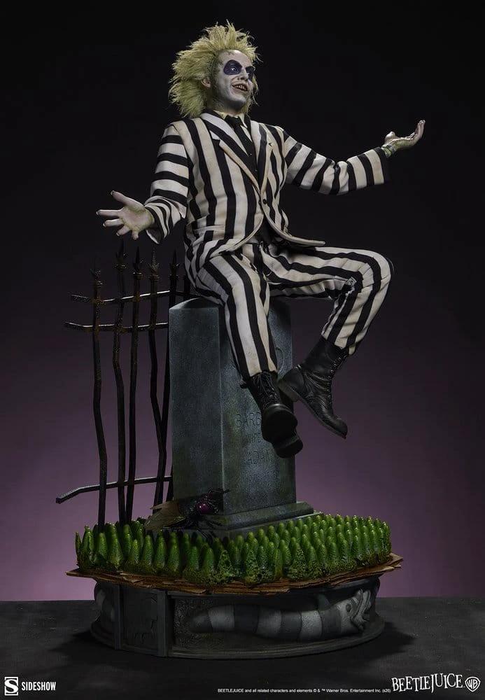 Beetlejuice Premium Format Statue by Sideshow Collectibles, 54 cm tall with striped suit on tombstone.